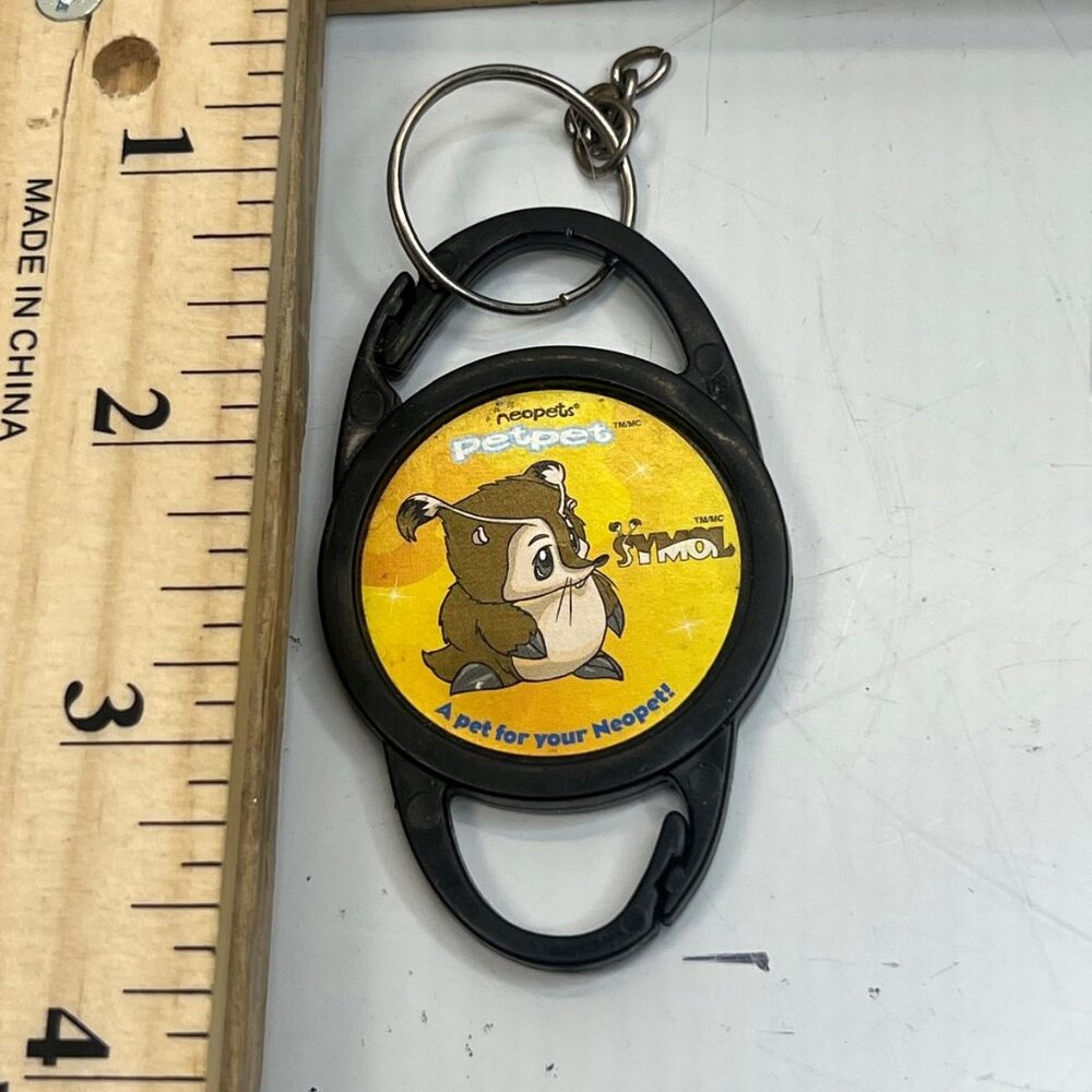 Neopets Petpet Keychain Collectible Simon Petpet McDonald’s Toy Black Yellow